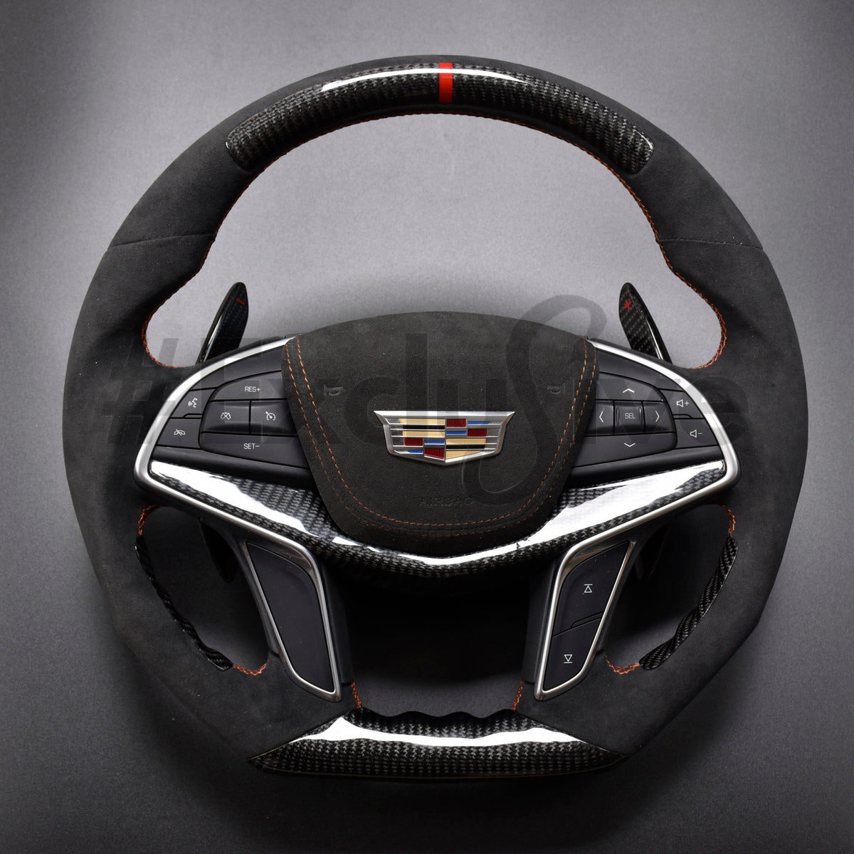 Custom Cadillac steering wheel in Alcantara and carbon fiber