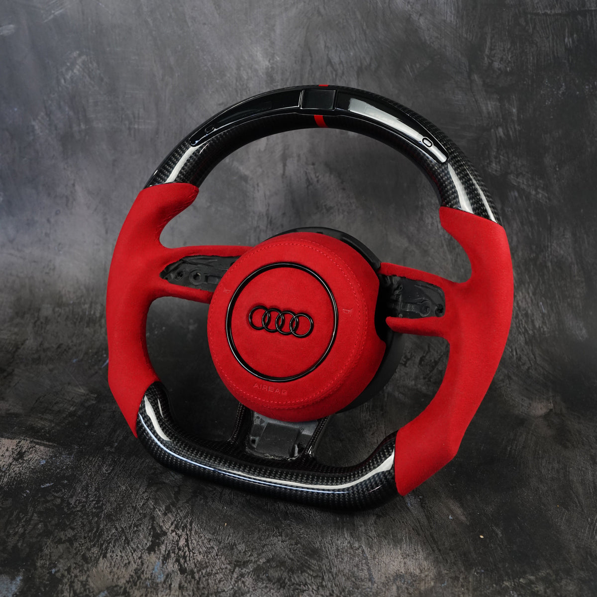 Custom Audi steering wheel in red Alcantara and carbon fiber
