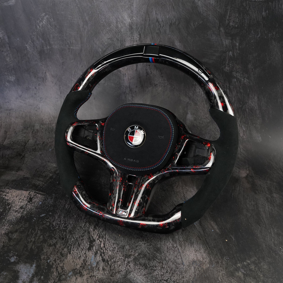 Custom BMW M Sport steering wheel in carbon fiber and leather