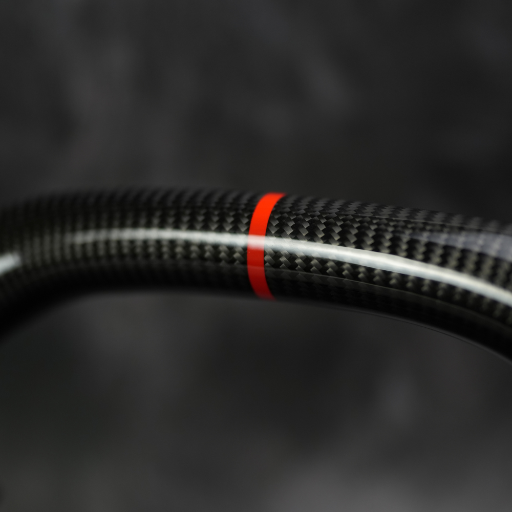 Red center stripe on a carbon fiber steering wheel rim
